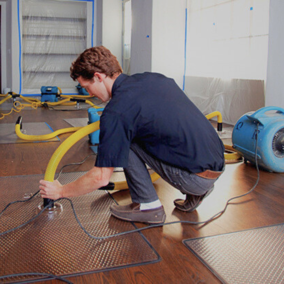 Technician working on floor restoration